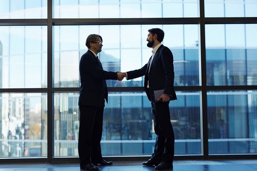 Successful collaboration, two men shaking hands
